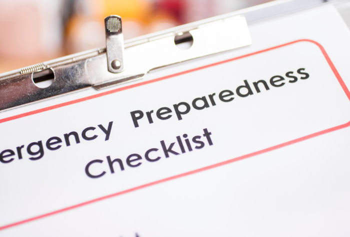 Emergency preparedness checklist on clipboard with pencil. No people.