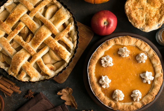 Thanksgiving oumokina dn apply vaious pies, top view, copy Space. Fall traditional homemade apple and pumpkiin pie for autumn holiday.